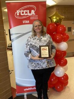 Mrs. Thacker receiving an award for being the FCCLA advisor of the year.