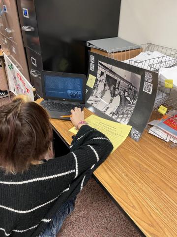 Another student reading on the computer