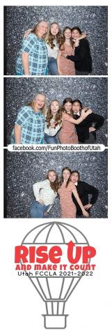 Autumn Brielle and Jaida in a photo booth with Mrs. Thacker