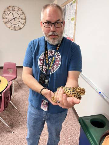 Mr. Thacker holding a snake