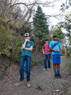 Students contemplate the beauty of nature while resting on the trail.