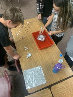 Students making tin foil boats